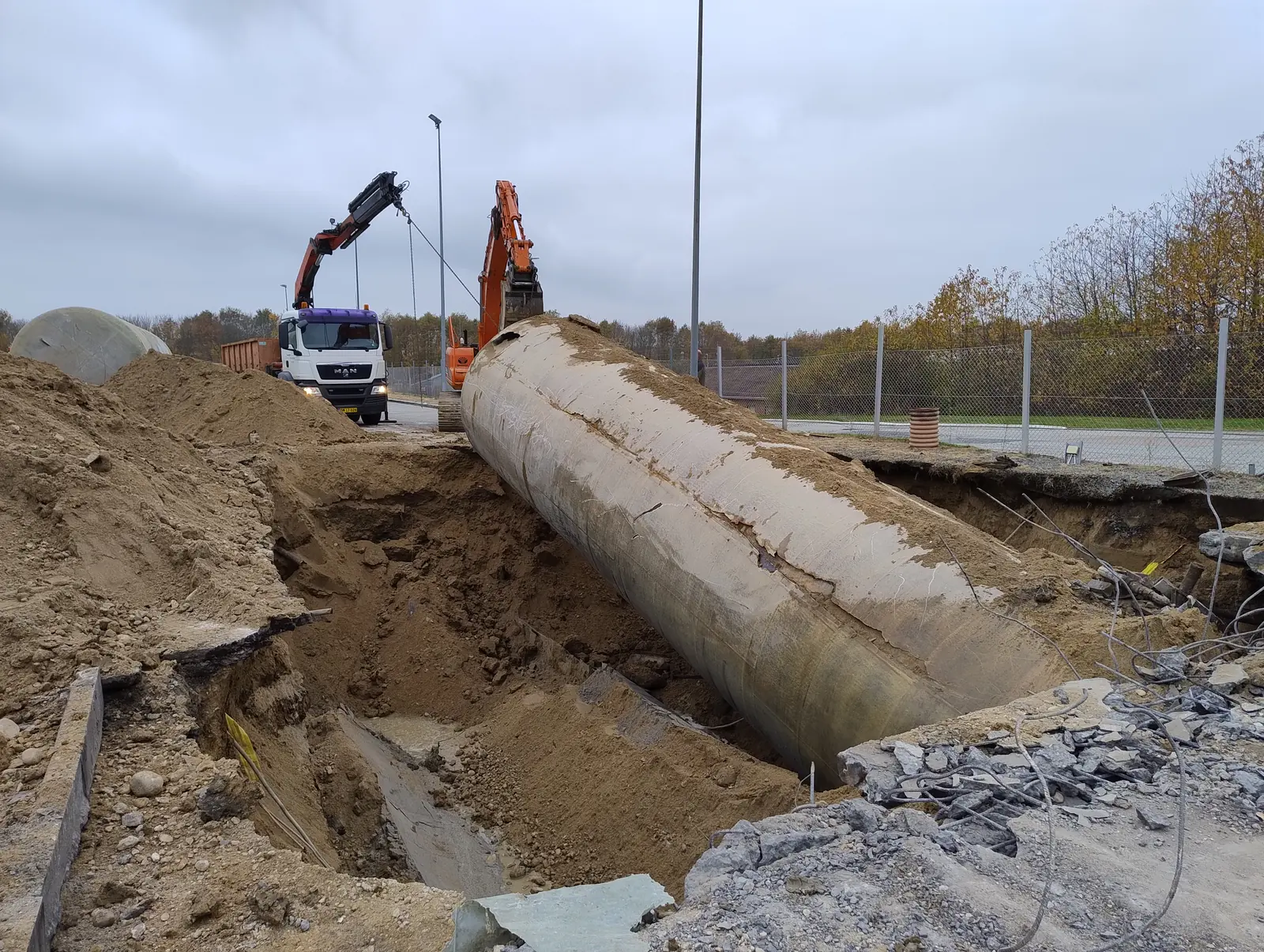 Tank exposed and supported during removal work